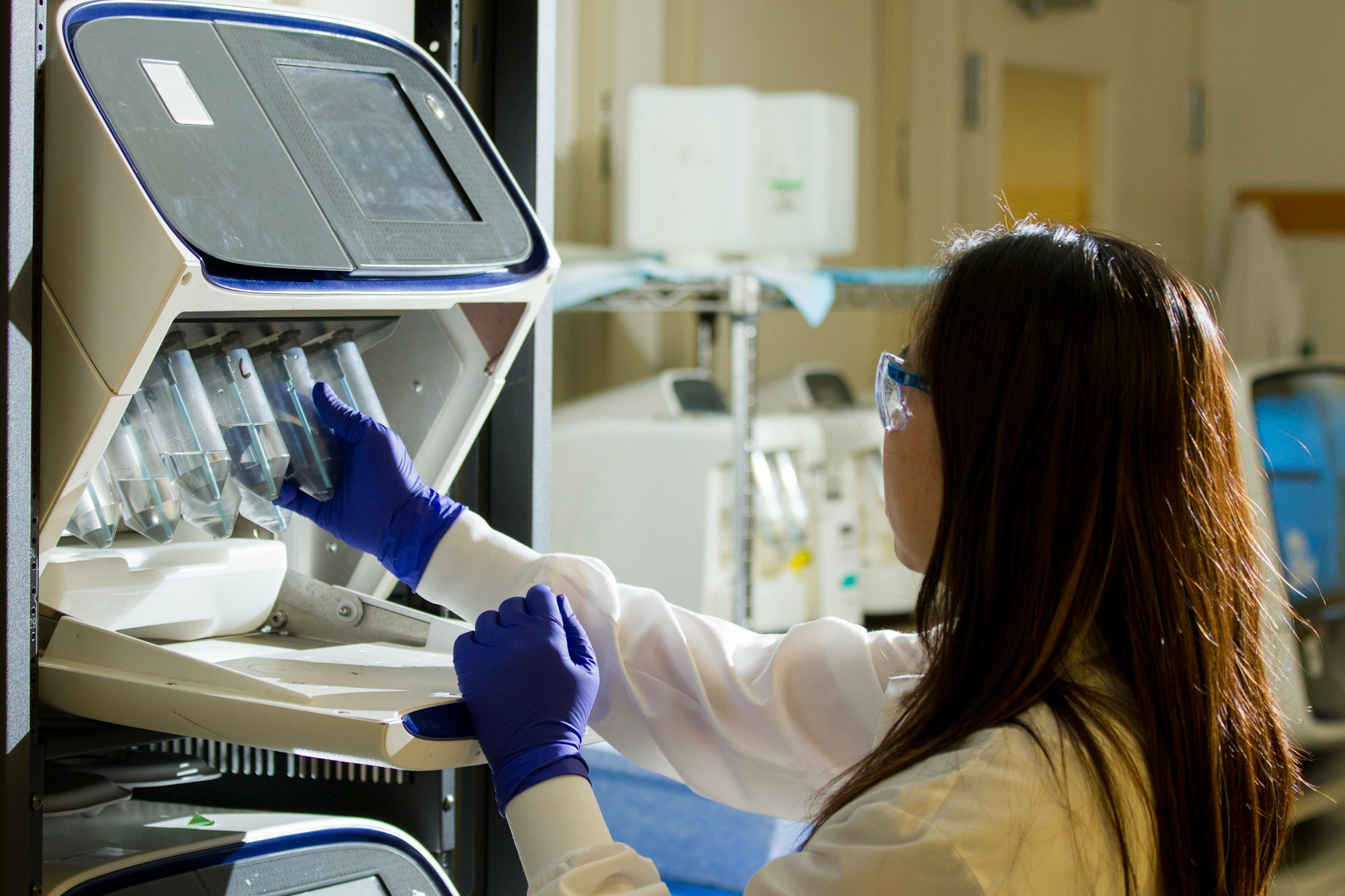 Evidence-Based, Hand-Selected Ingredients woman holding test tubes